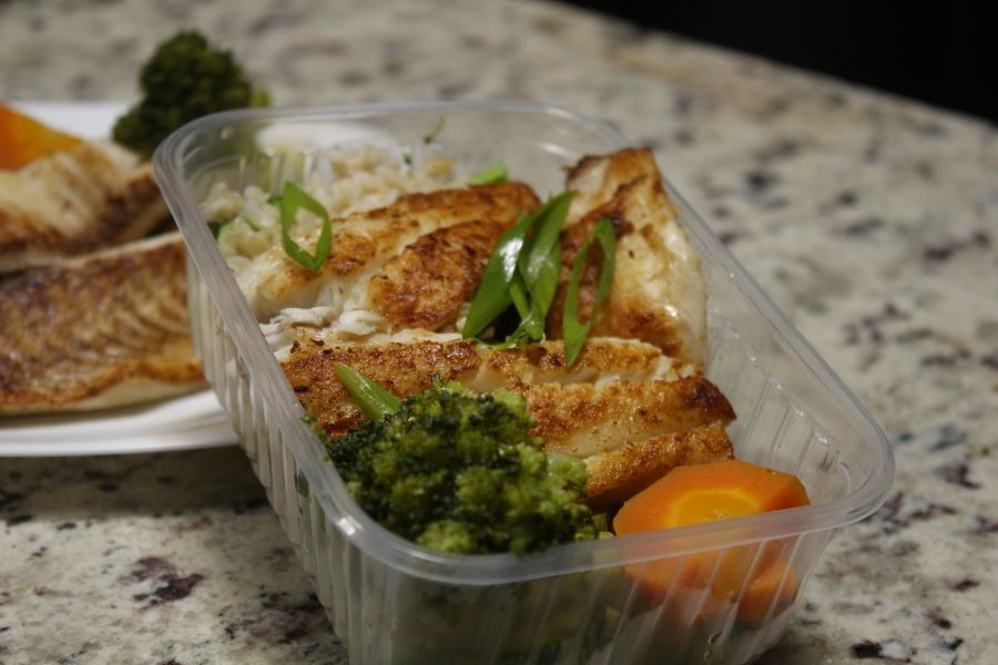 Three plates of asian food on wood table